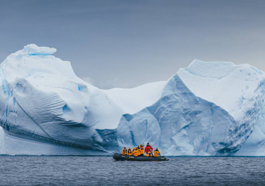 Quark Expeditions guests go Zodiac cruising with their Expedition Guide in the Antarctica Peninsula.