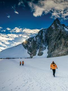 Passengers hiking in Antarctic Landscape