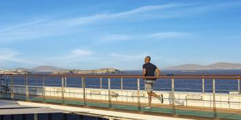 Guest running on track on wraparound deck